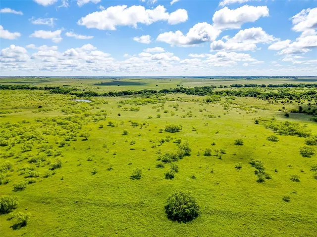 a view of a yard with an outdoor seating