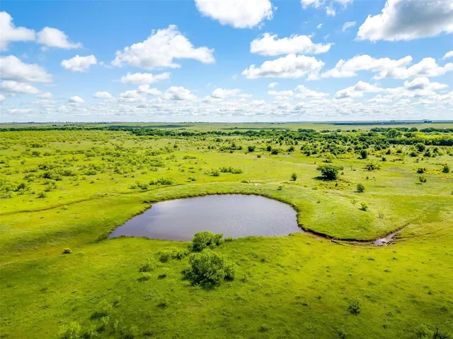 a view of a lake with a big yard