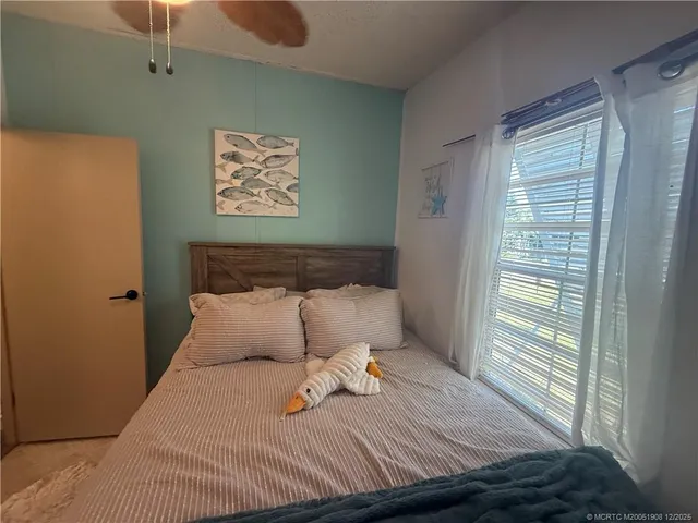 a view of a house with backyard porch and sitting area