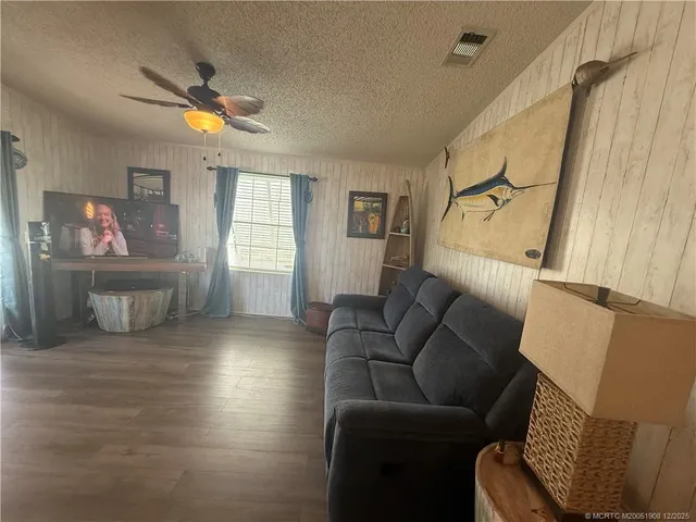 a view of a chairs and table in a balcony