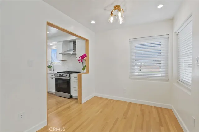 a kitchen view of a stove and a refrigerator