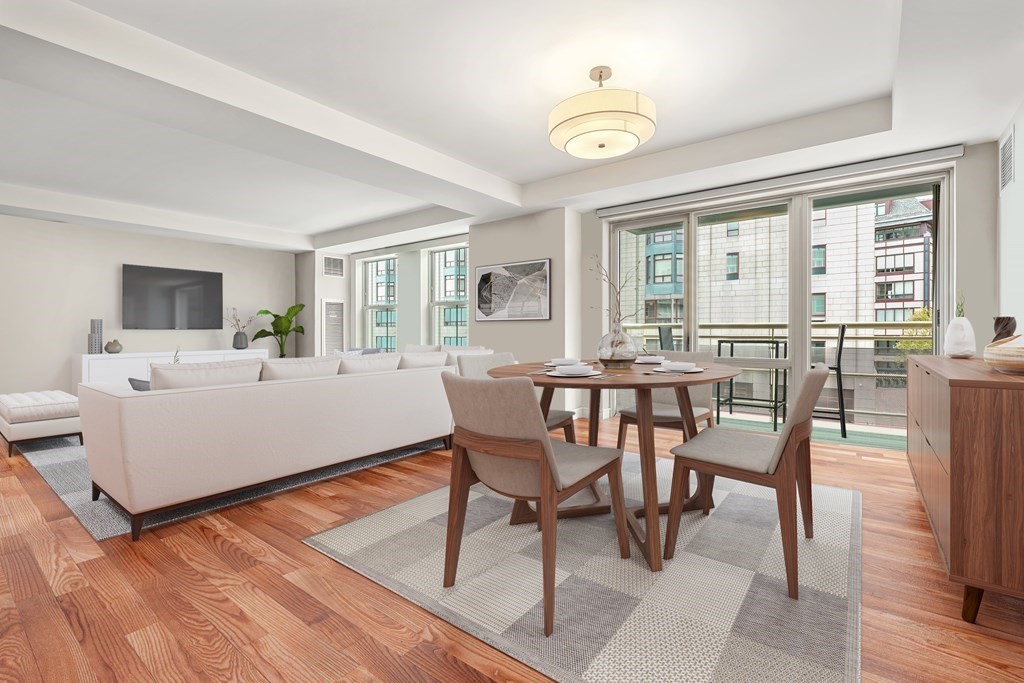 4 Battery Wharf, Unit 4305 Boston, MA 02109 - Photo 1 of 17 a view of a dining room with furniture window and wooden floor