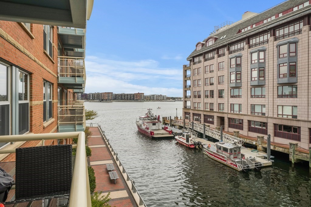 4 Battery Wharf, Unit 4305 Boston, MA 02109 - Photo 7 of 17 a view of a lake with building in front of it