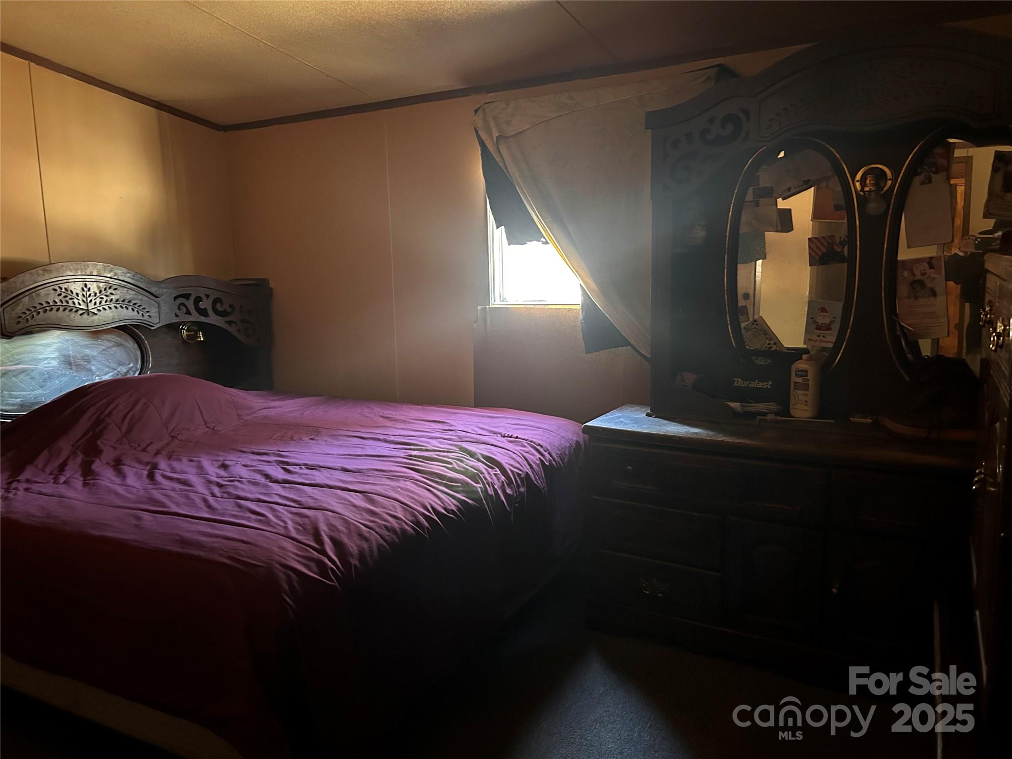 2407 Heyward Brockington Road, Unit 7 Columbia, SC 29203 - Photo 11 of 16 a bedroom with a bed and a mirror