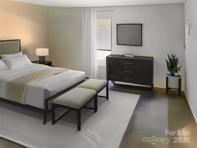 a bedroom with a bed and a mirror