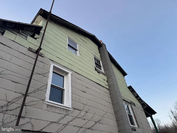 a front view of a house with stairs