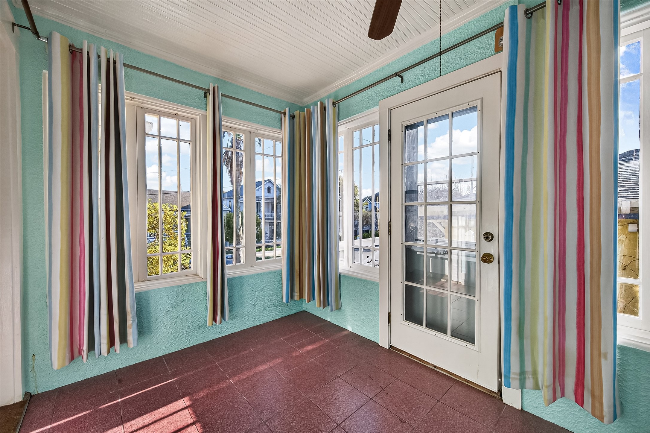 1723 Rosenberg Street Galveston, TX 77550 - Photo 18 of 38 Sunroom with large windows bringing in natural light.