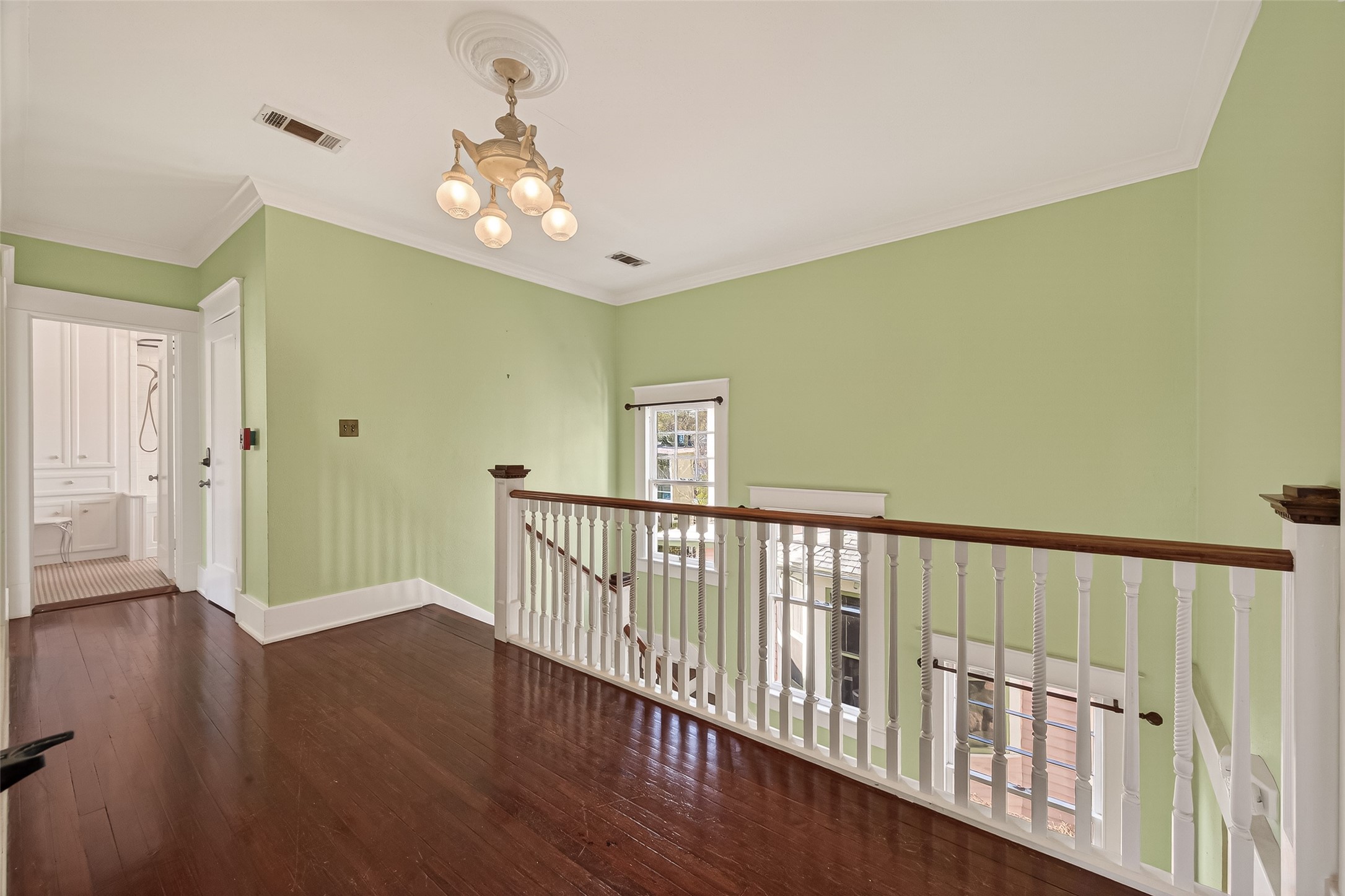 1723 Rosenberg Street Galveston, TX 77550 - Photo 19 of 38 Upstairs hallway overlooking the foyer.