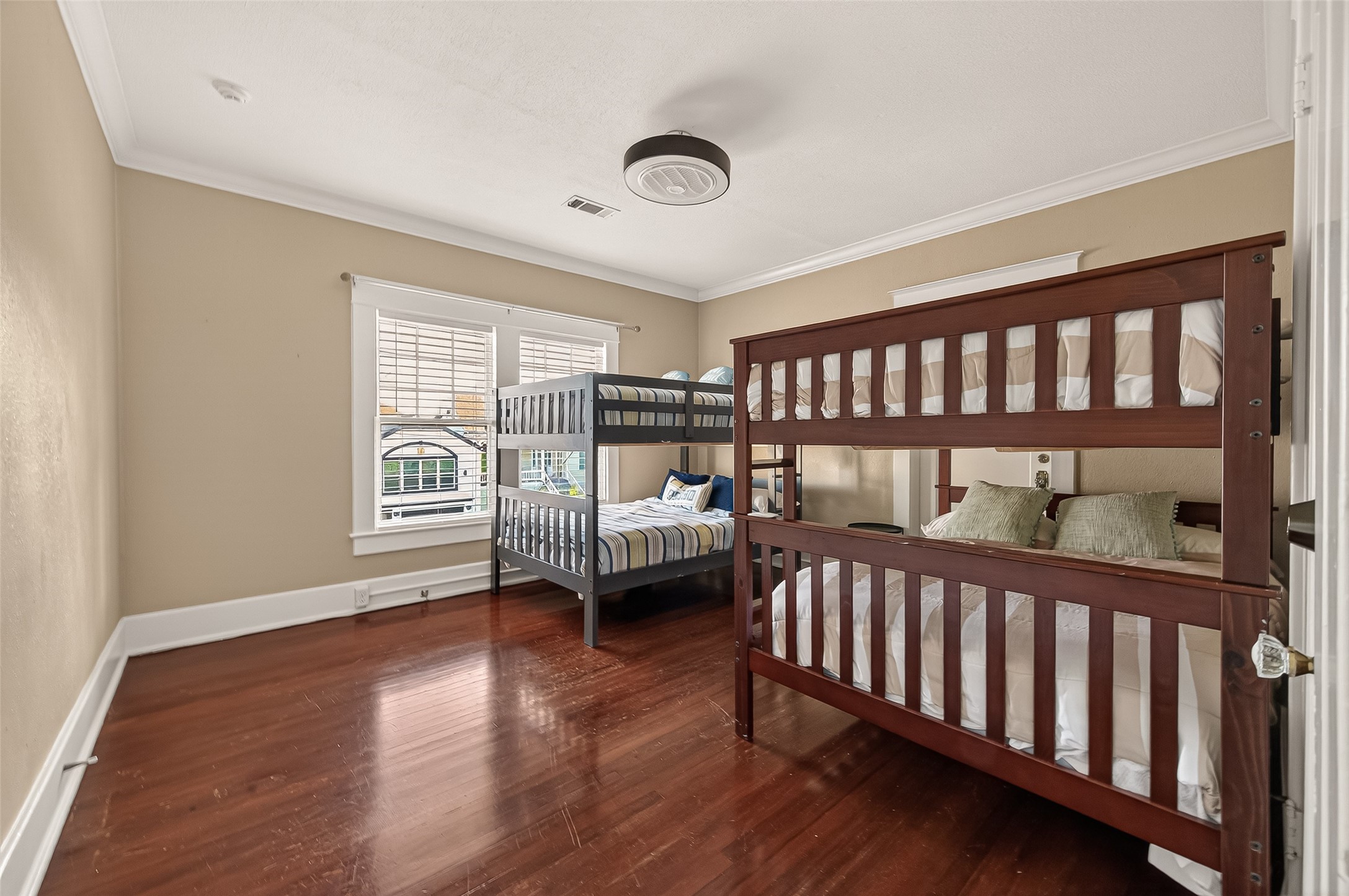 1723 Rosenberg Street Galveston, TX 77550 - Photo 23 of 38 Spacious bedroom with hardwood flooring and natural light.