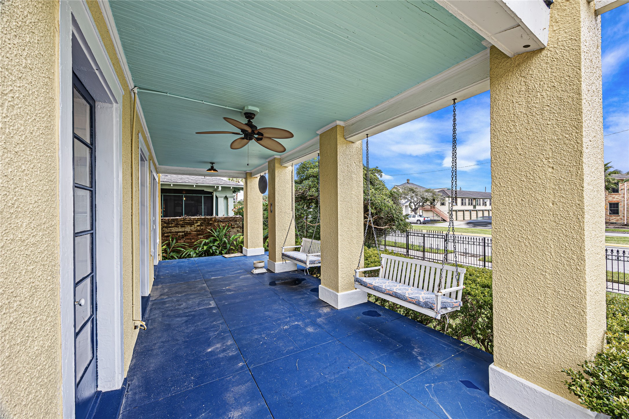 1723 Rosenberg Street Galveston, TX 77550 - Photo 3 of 38 Covered front porch with ceiling fan and seating area for relaxing outdoors.