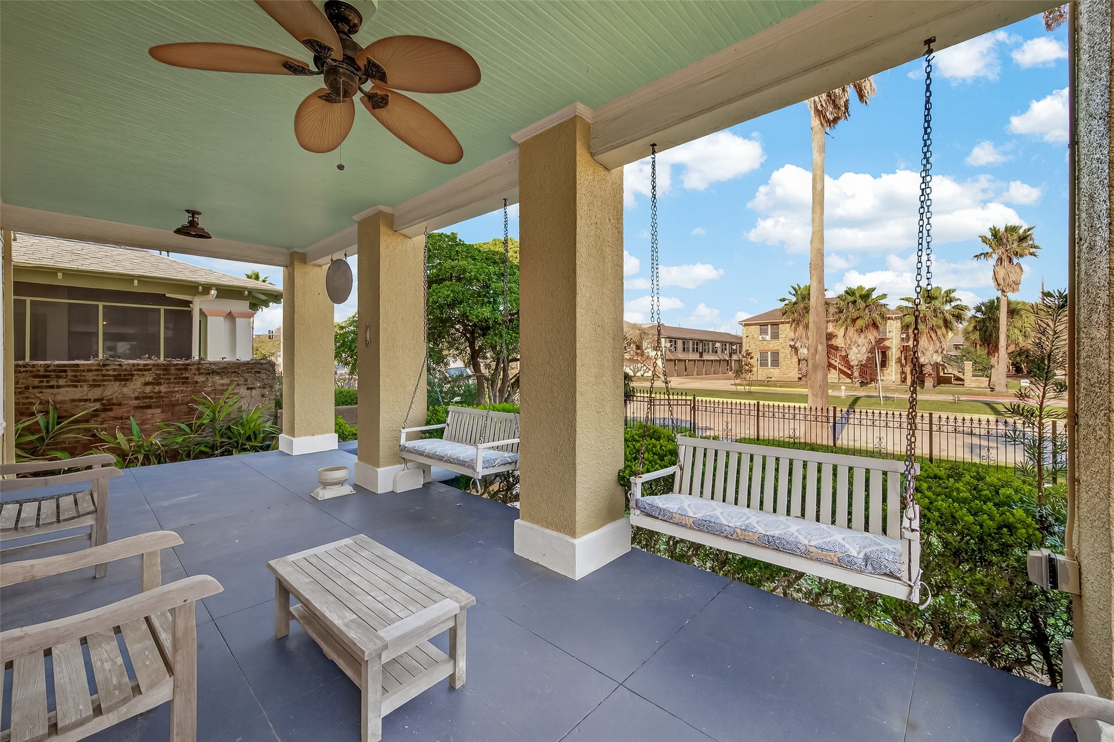 1723 Rosenberg Street Galveston, TX 77550 - Photo 4 of 38 Enjoy relaxing porch views of the landscaped front yard and charming streetscape.