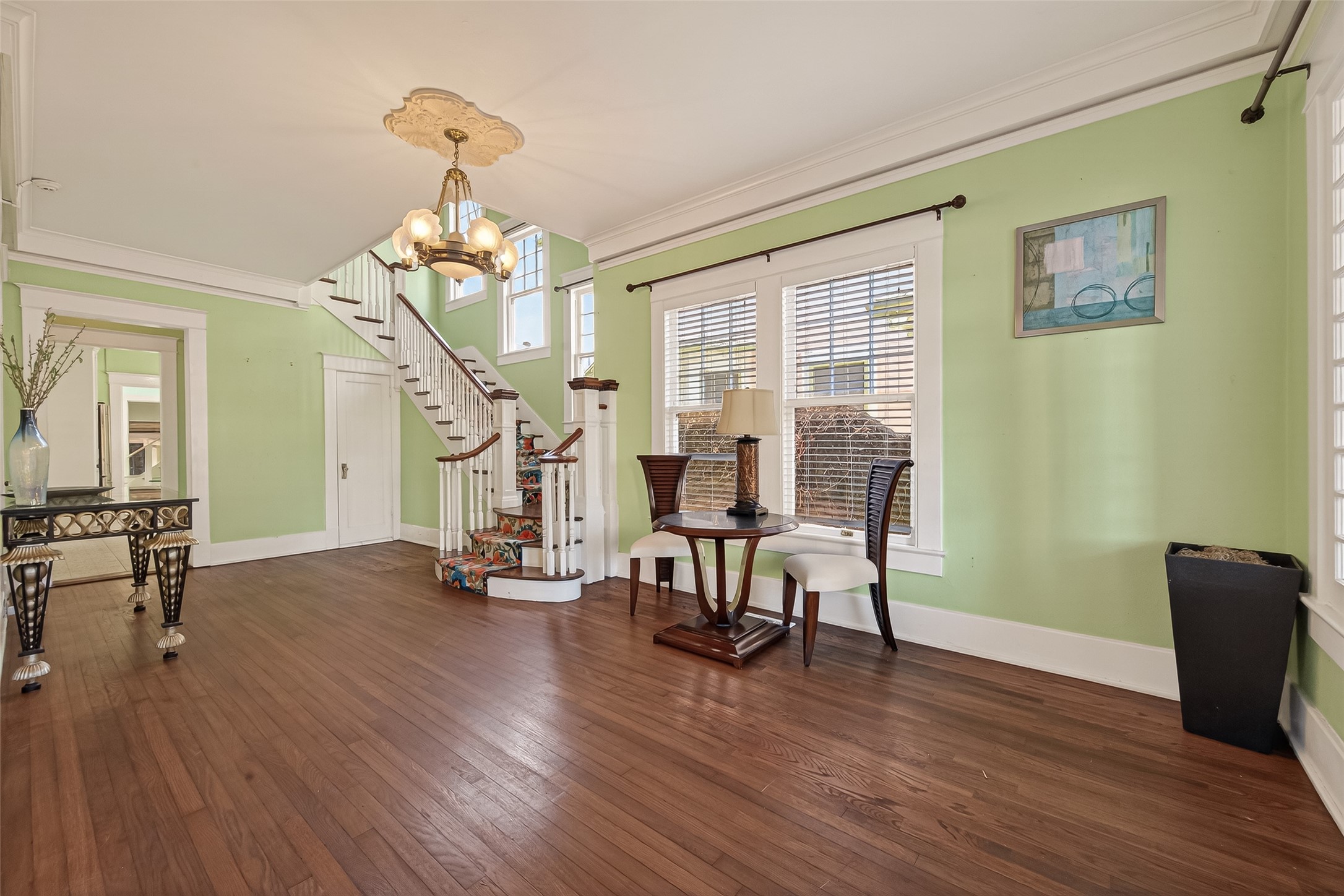 1723 Rosenberg Street Galveston, TX 77550 - Photo 8 of 38 Welcoming foyer featuring warm wood flooring and an inviting entry into the main living areas.
