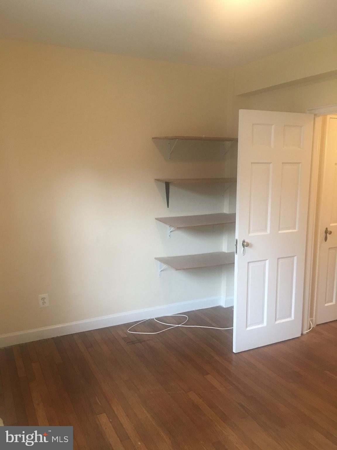 203 East Glebe Road, Unit D Alexandria, VA 22305 - Photo 8 of 12 a view of a room with wooden floor