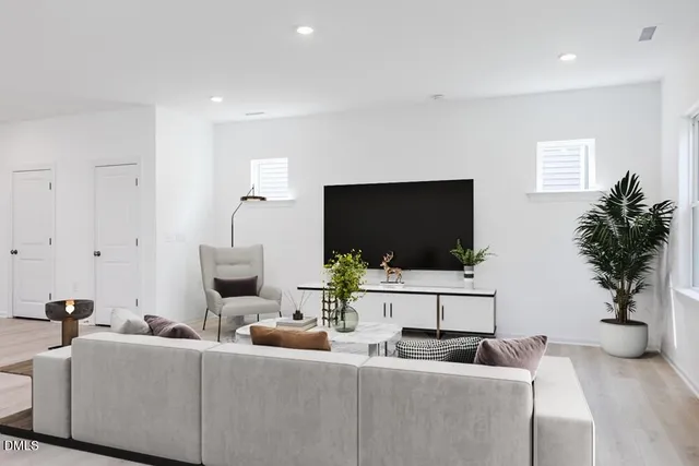 a kitchen with stainless steel appliances a sink a stove a microwave a counter top space and cabinets