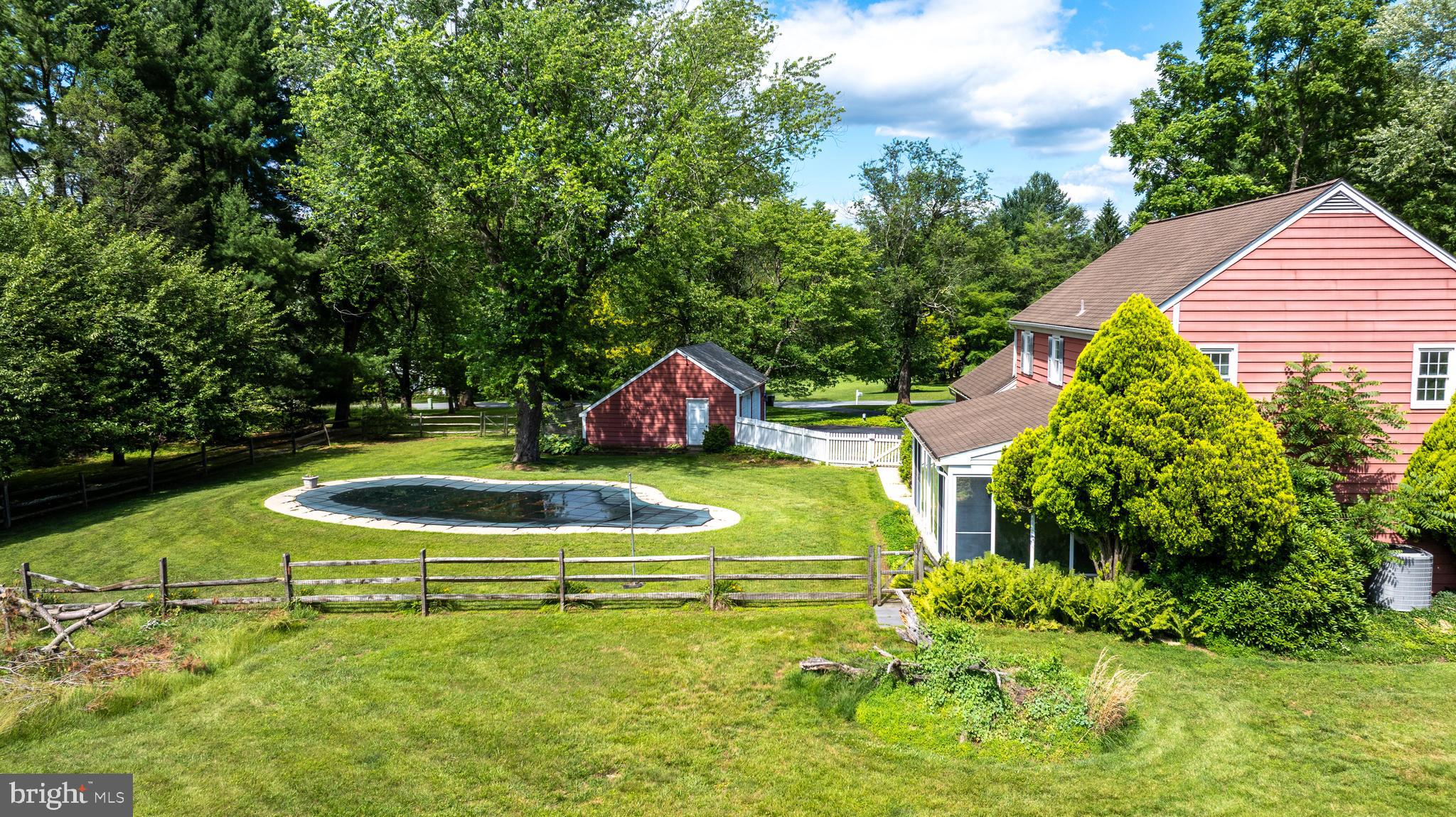 1929 Hillendale Road Chadds Ford, PA 19317 - Photo 9 of 56 a view of a swimming pool with a yard