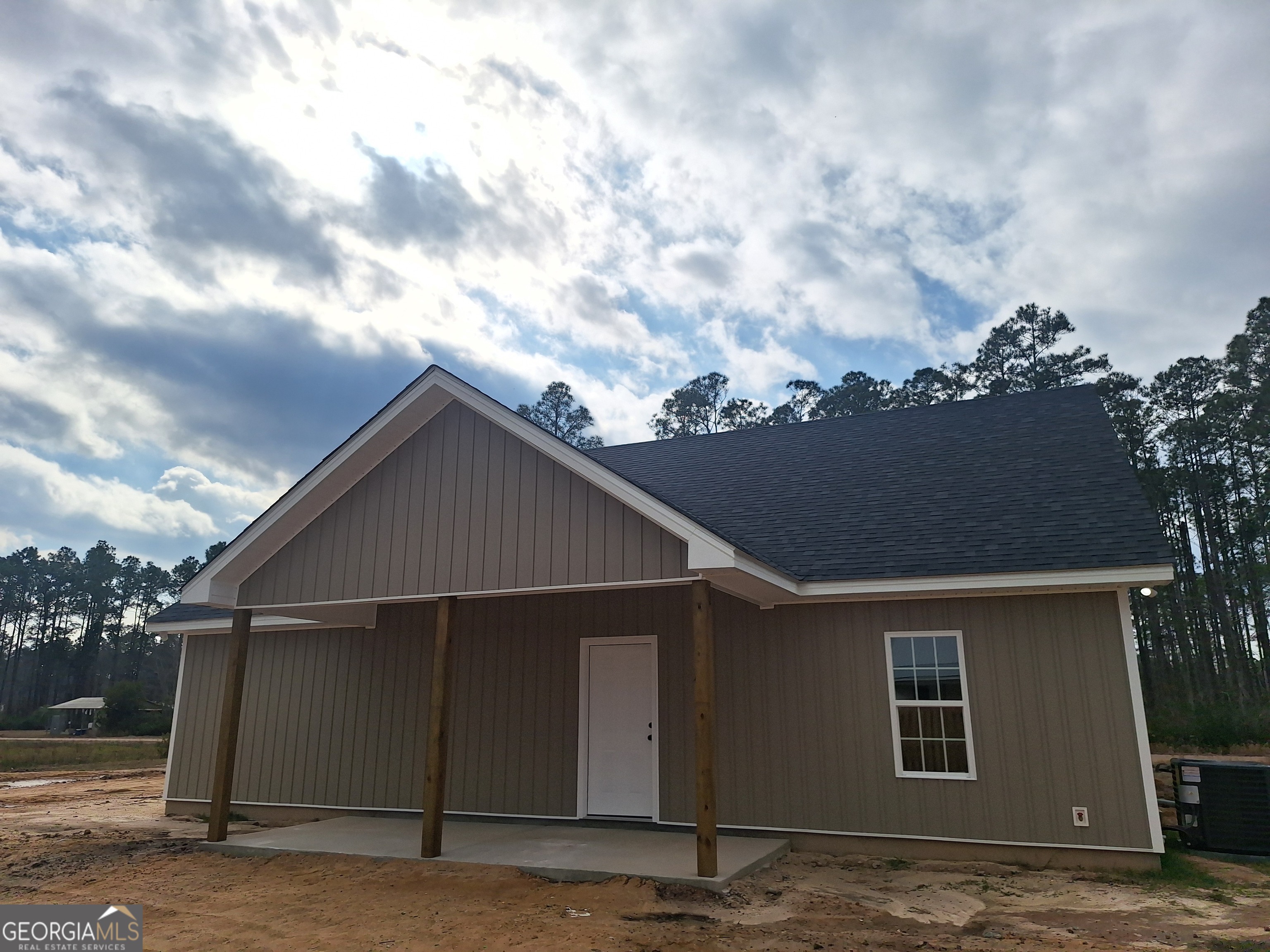 155 Peach Lane Baxley, GA 31513 - Photo 19 of 19 a backyard of a house with lots of green space