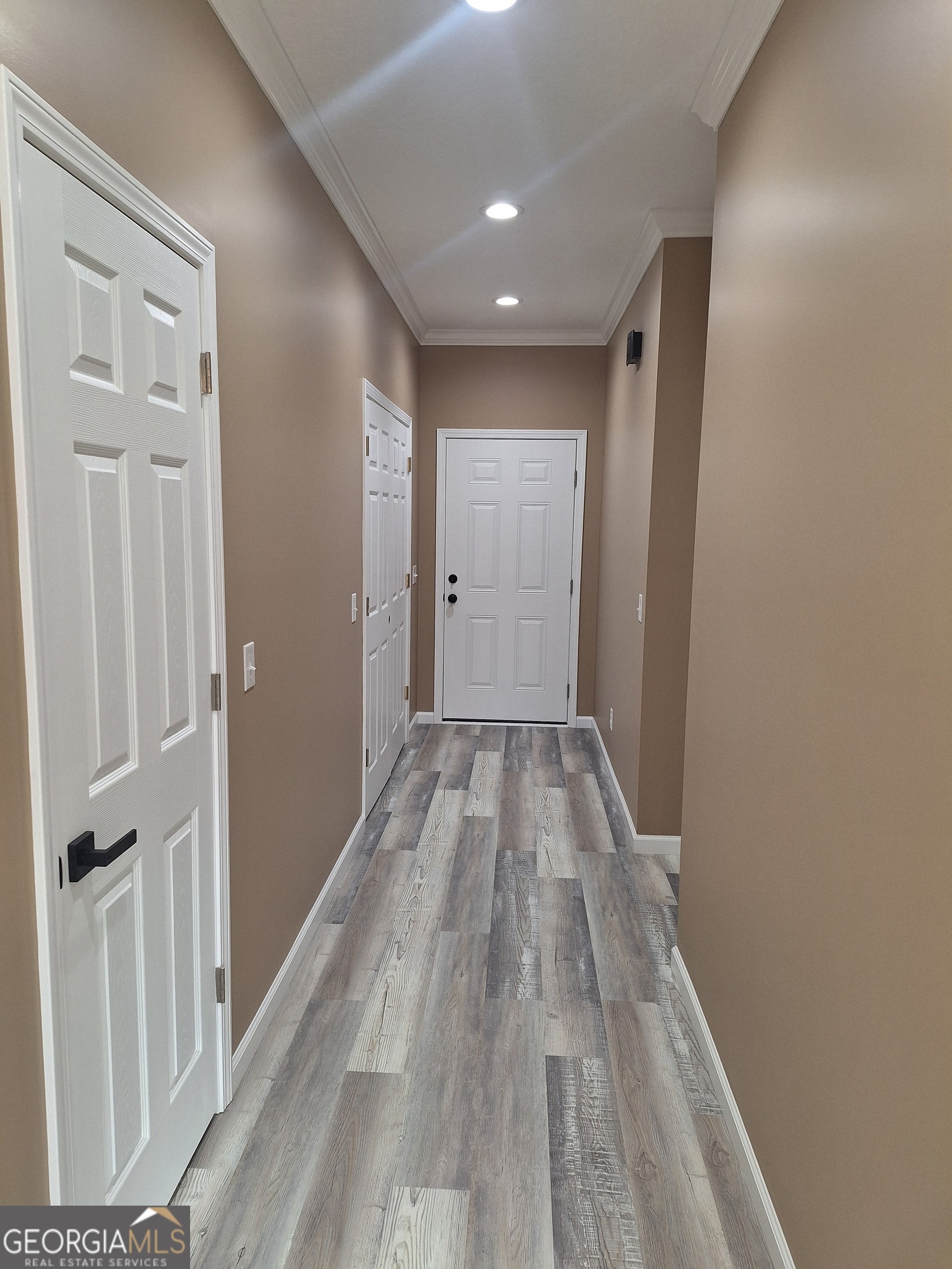 155 Peach Lane Baxley, GA 31513 - Photo 10 of 19 a view of a room with wooden floor and entryway