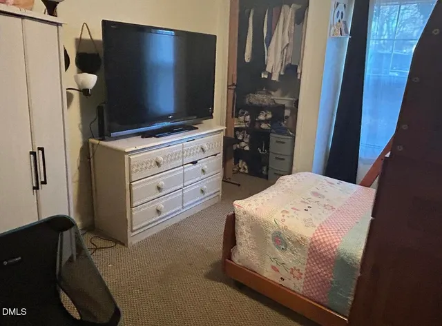 a room with cabinets and flat screen tv