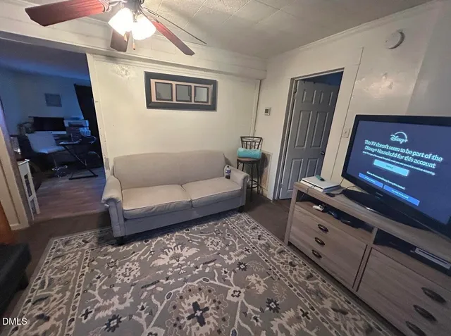 a living room with furniture and a rug