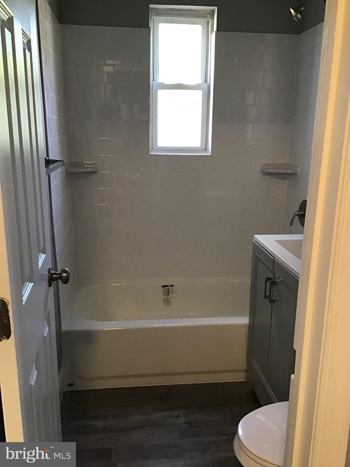 5027 H Street Southeast, Unit 3 Washington, DC 20019 - Photo 2 of 4 a bathroom with a toilet and a shower