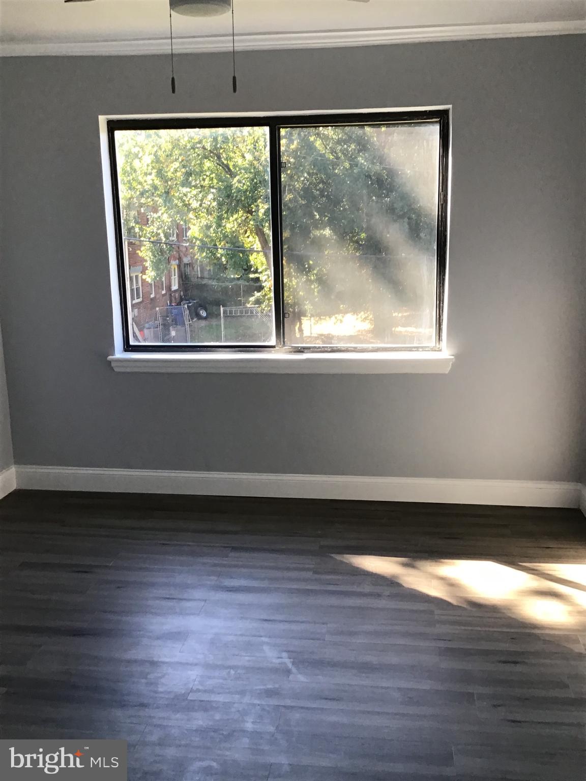 5027 H Street Southeast, Unit 3 Washington, DC 20019 - Photo 3 of 4 a view of a big room with wooden floor and a window