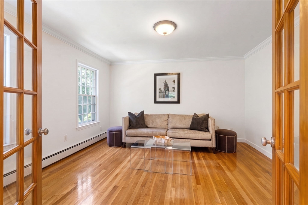 24 Russett Hill Road Sherborn, MA 01770 - Photo 4 of 39 a living room with furniture and a wooden floor