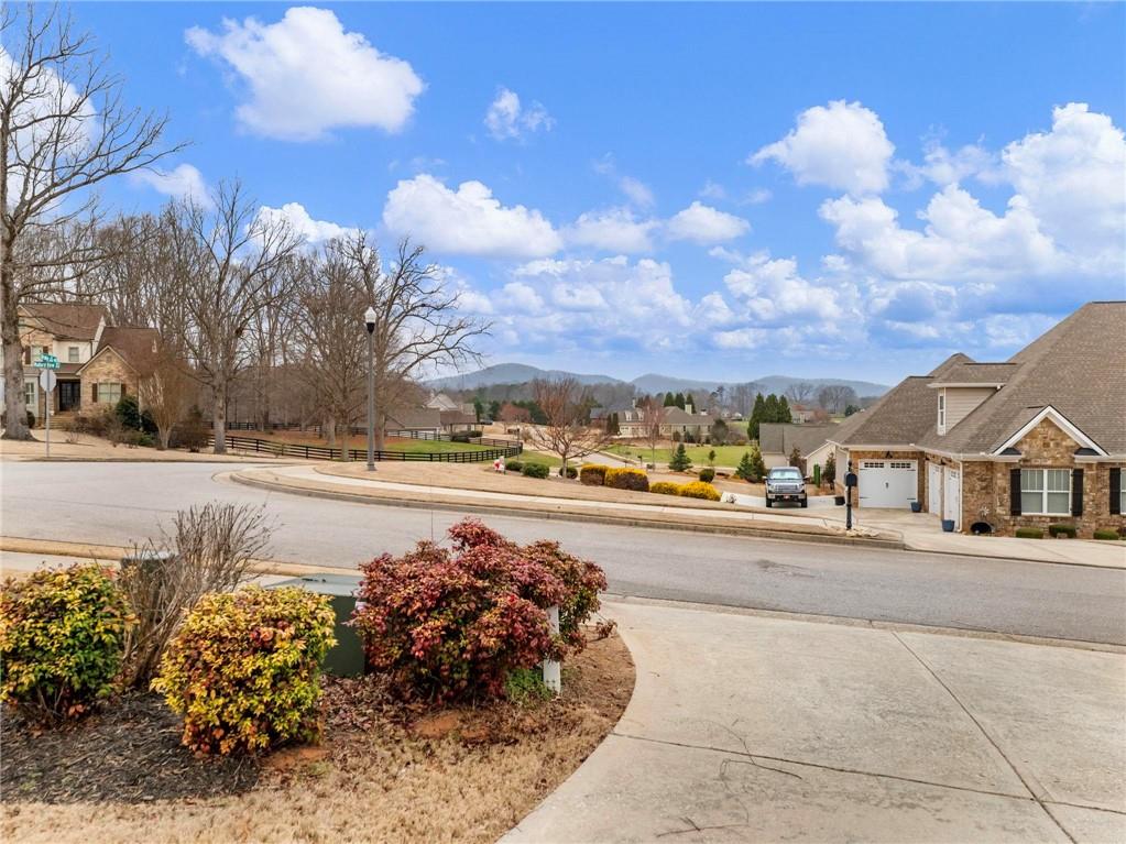 8629 Drake Drive Lula, GA 30554 - Photo 75 of 78 a view of a street with a building in the background