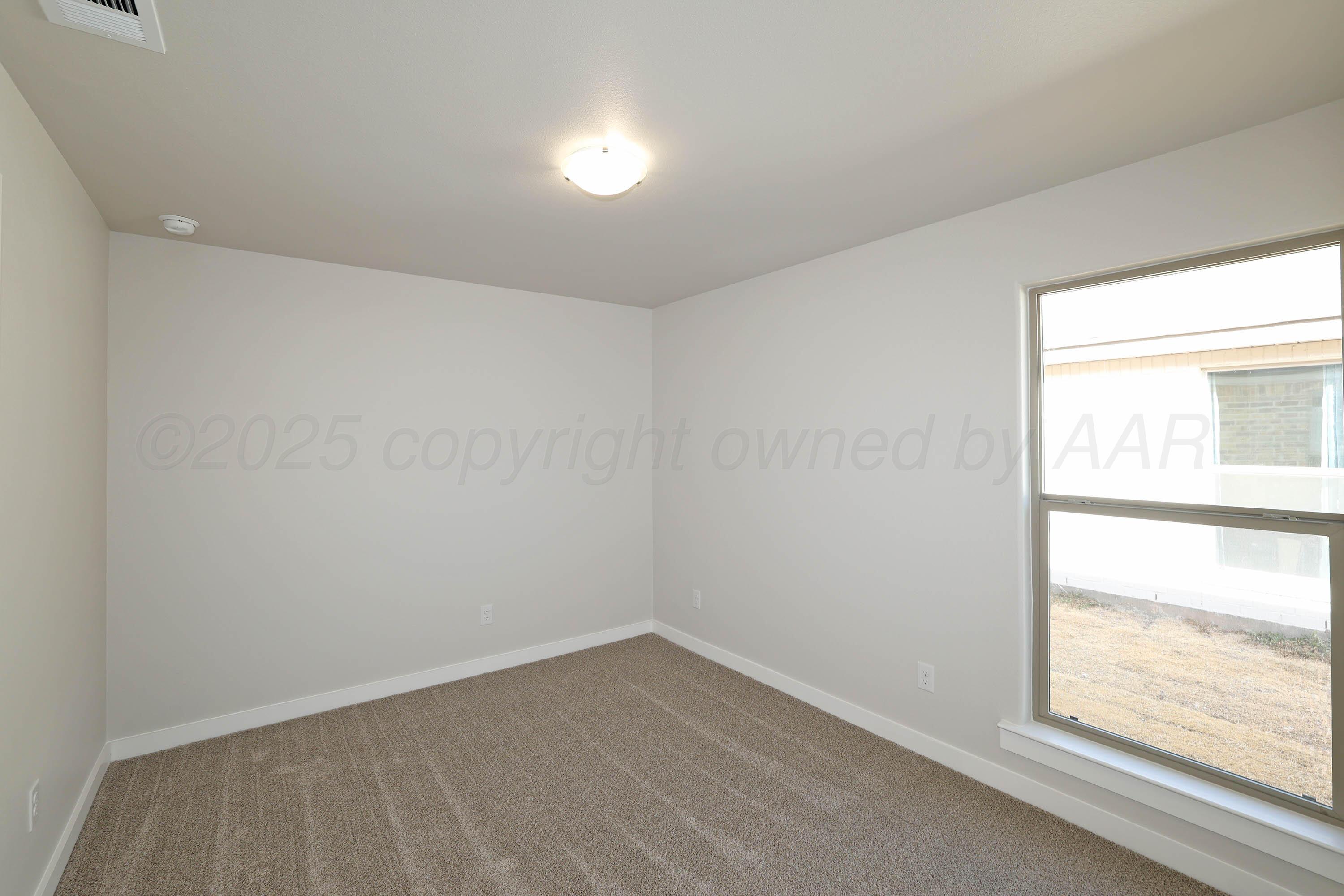 3003 Swenson Street Amarillo, TX 79124 - Photo 17 of 23 an empty room with a window