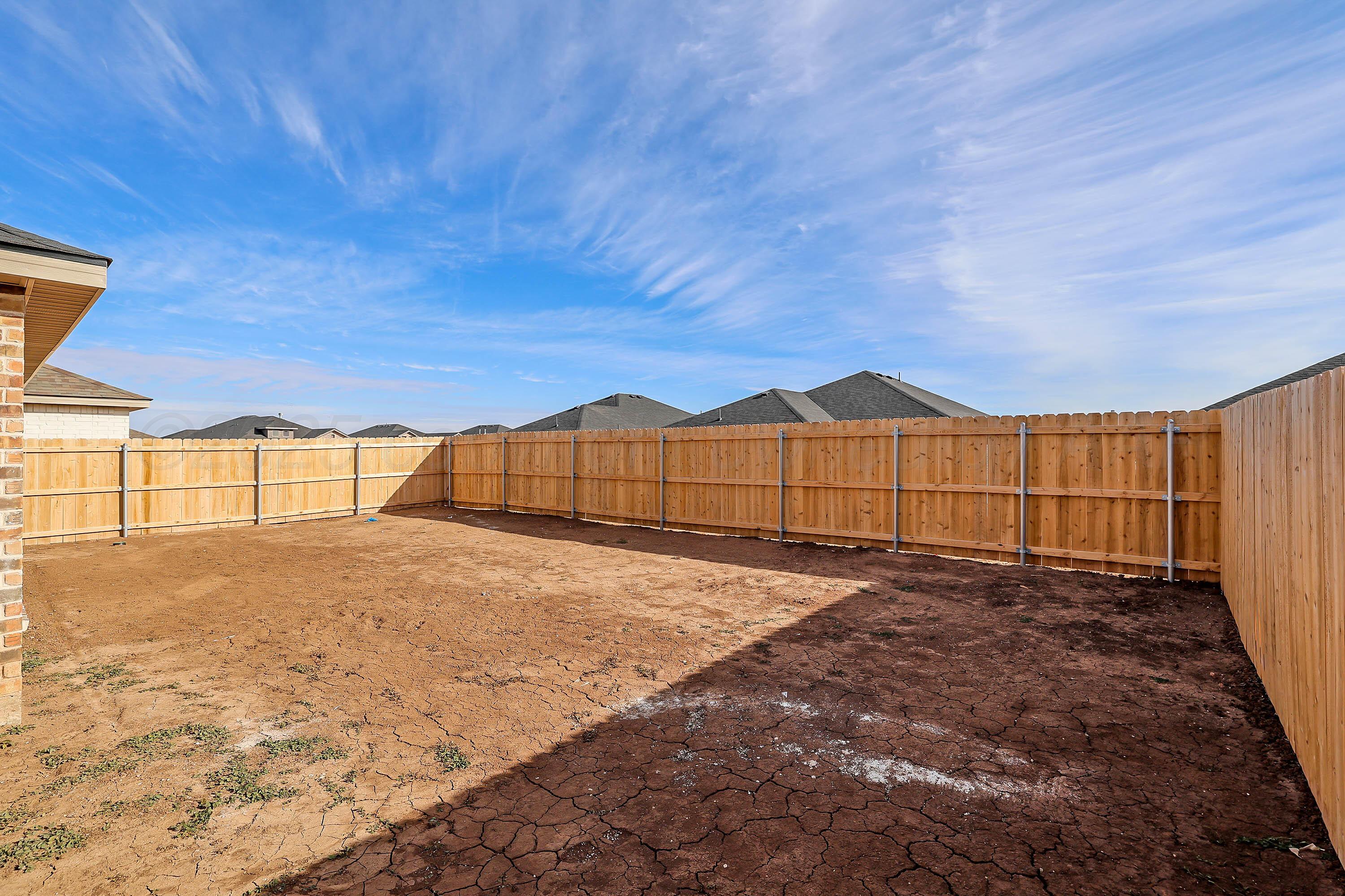 3003 Swenson Street Amarillo, TX 79124 - Photo 4 of 23 a view of an outdoor space with wooden fence
