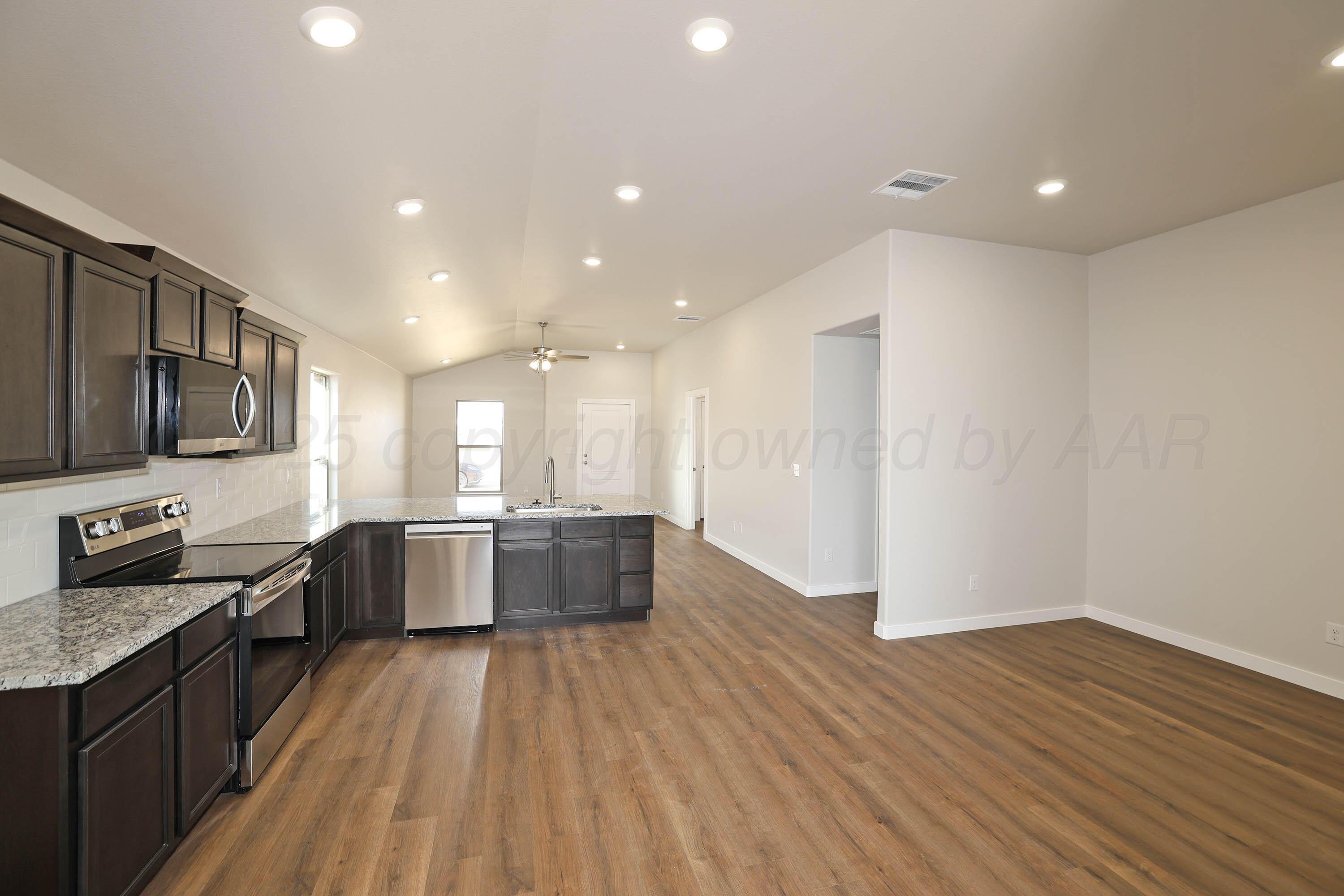 3003 Swenson Street Amarillo, TX 79124 - Photo 23 of 23 a large kitchen with a lot of counter space and stainless steel appliances