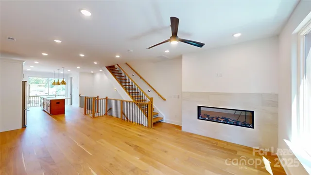 a view of entryway and hall with wooden floor