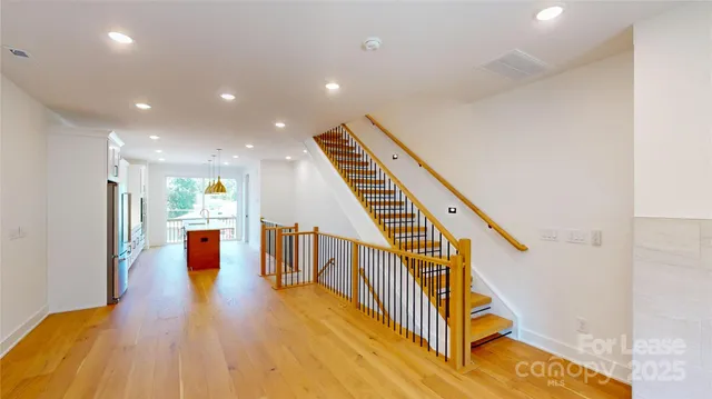 a view of an entryway with wooden floor