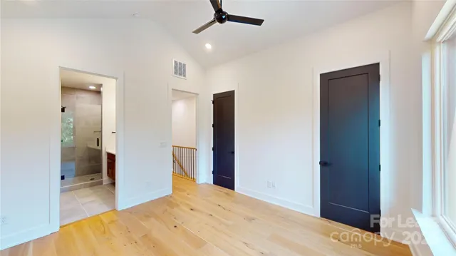 a bedroom with a bed and a bathroom