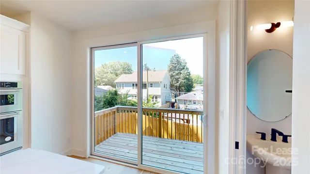 a view of a balcony with wooden floor