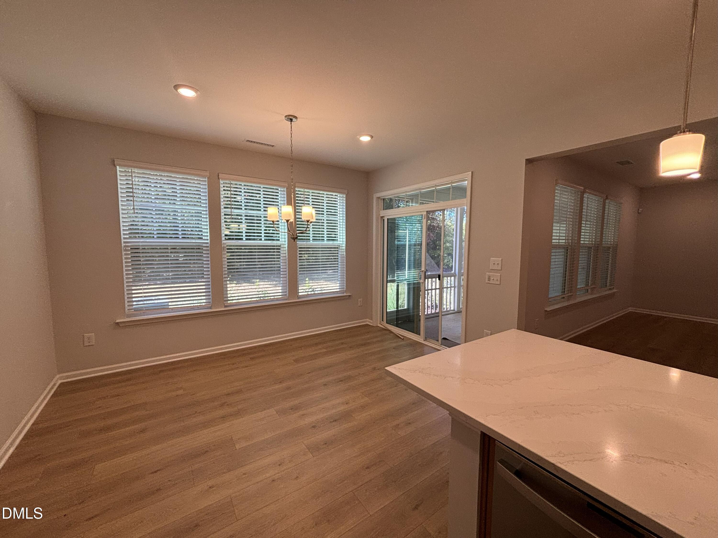 2105 Goudy Drive Raleigh, NC 27615 - Photo 14 of 41 a view of an empty room with wooden floor and a window