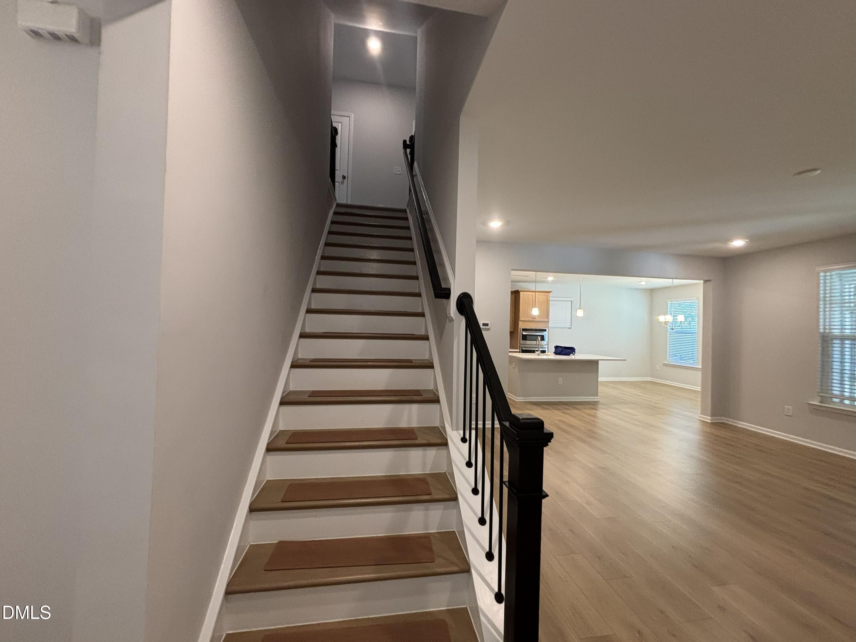 2105 Goudy Drive Raleigh, NC 27615 - Photo 18 of 41 a view of entryway and hall with wooden floor