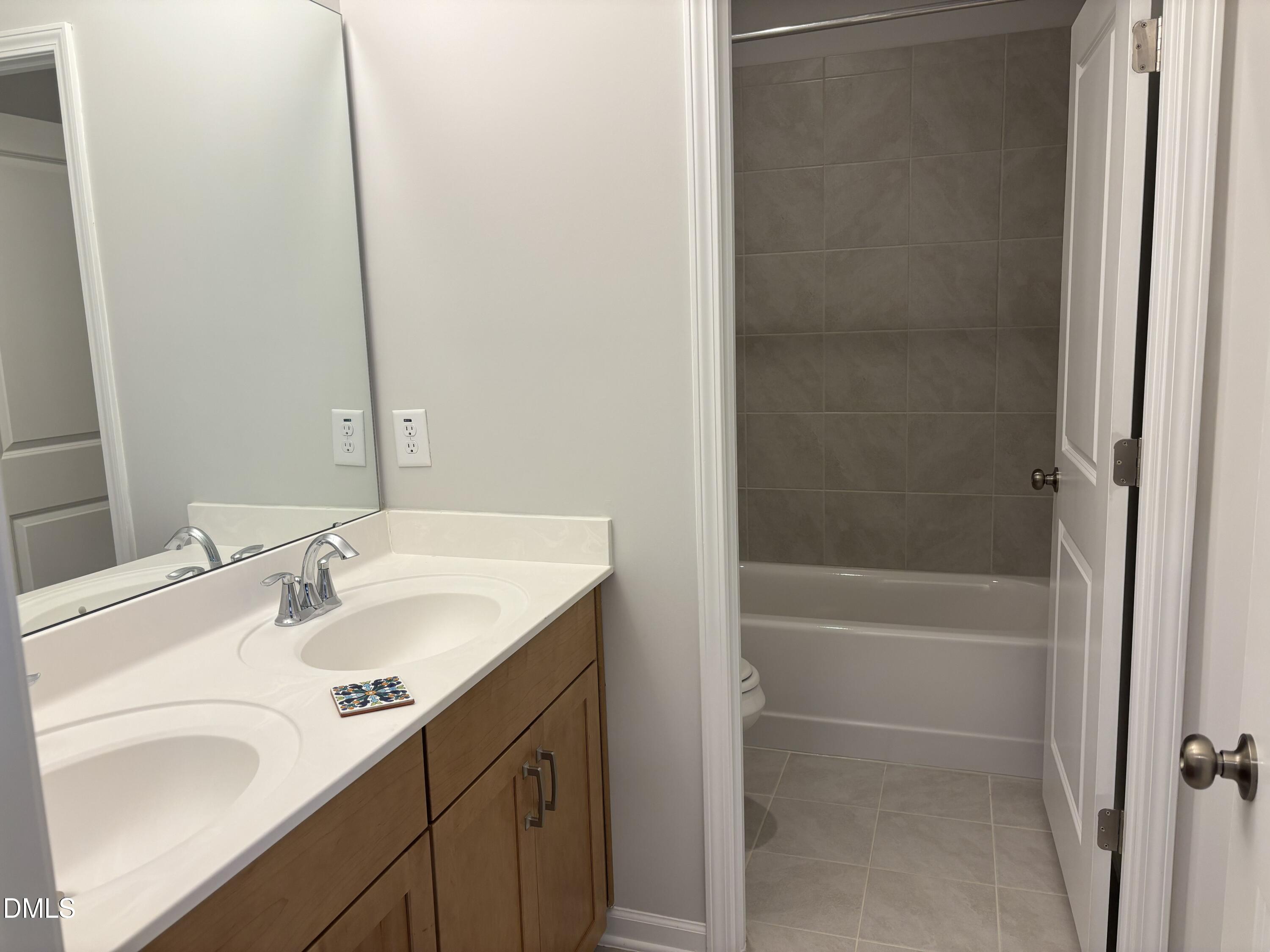 2105 Goudy Drive Raleigh, NC 27615 - Photo 20 of 41 a bathroom with a sink and a mirror