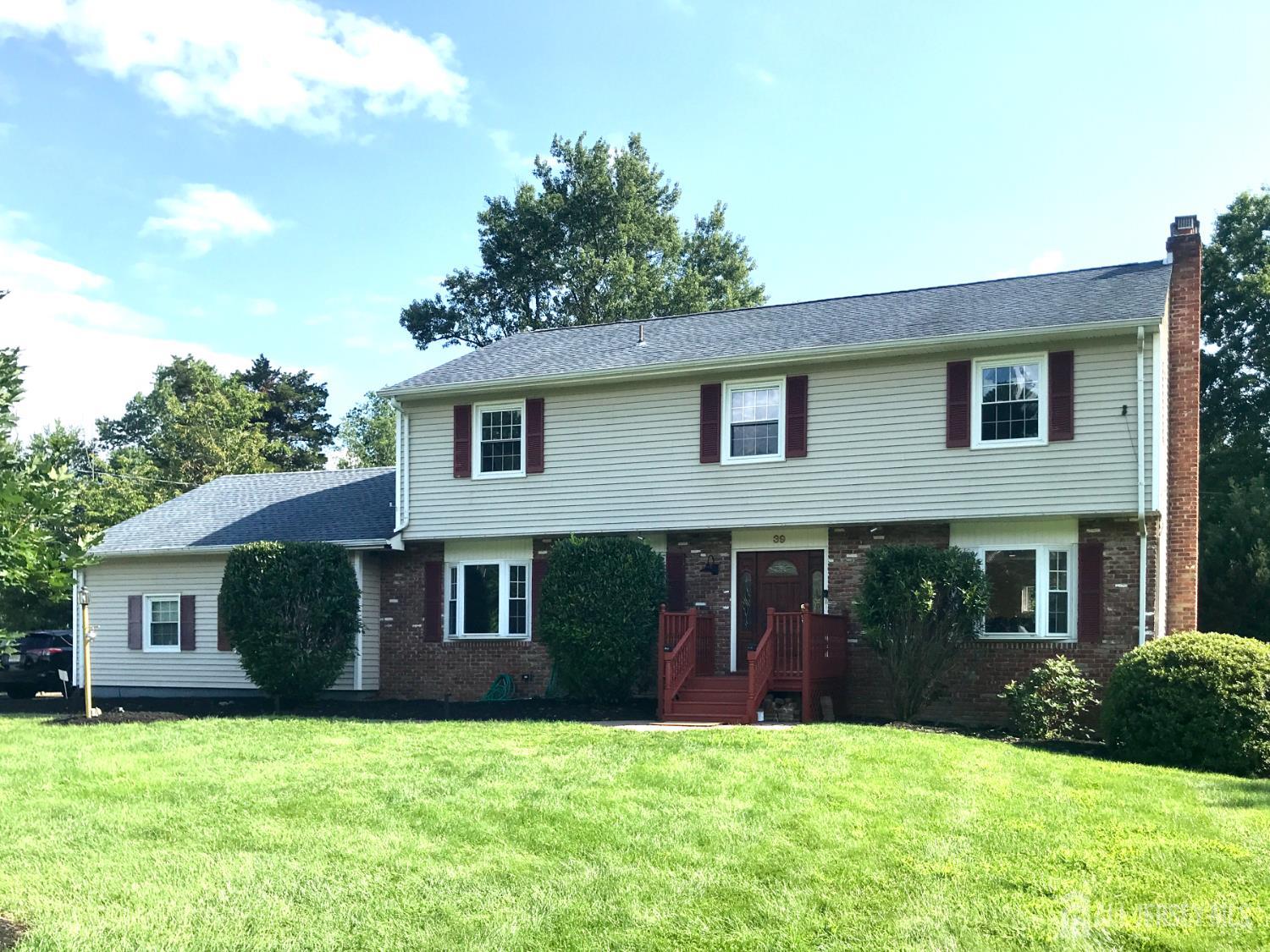 39 Taylor Road Monmouth Junction, NJ 08852 - Photo 1 of 36 a house that has a big yard in front of it