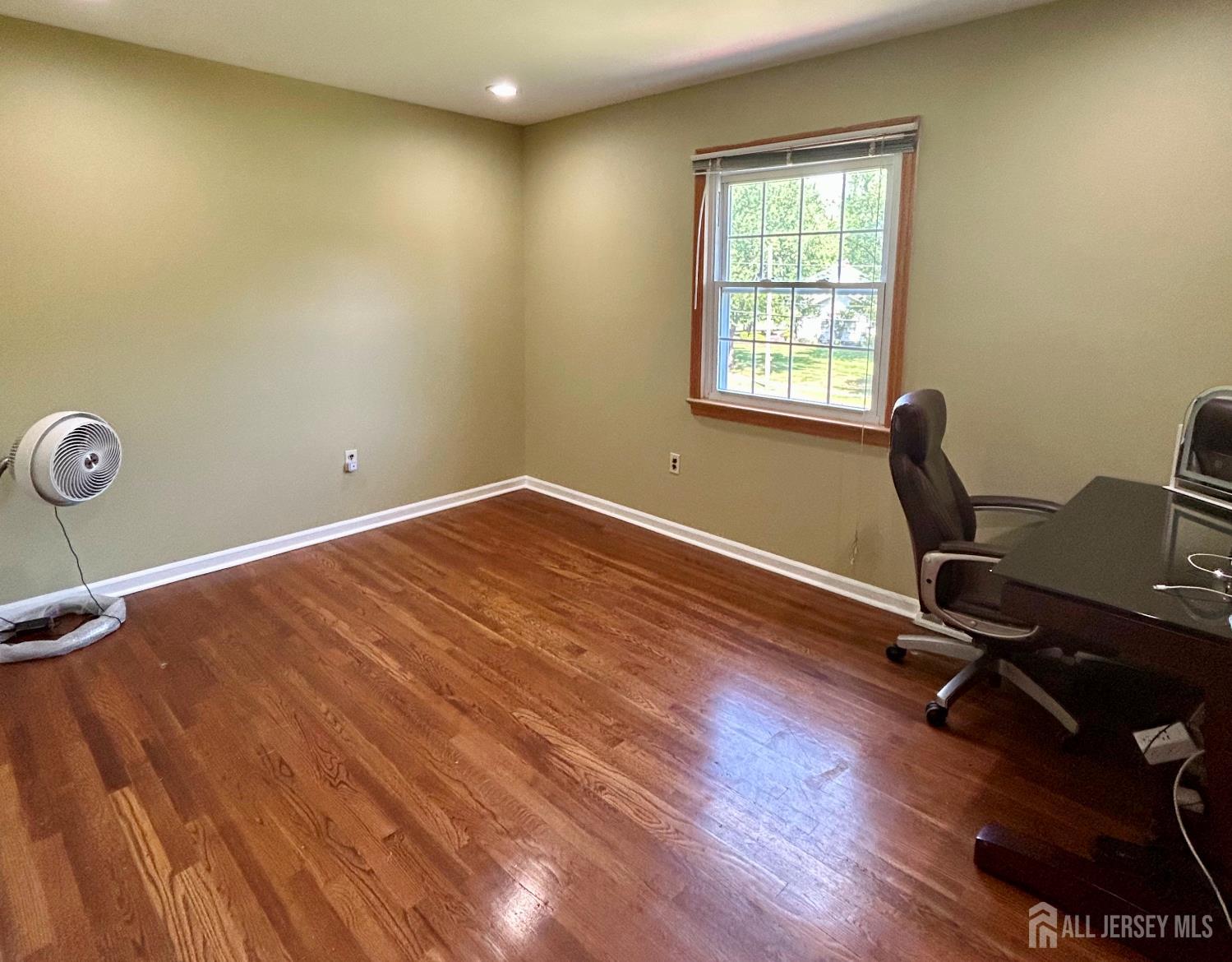 39 Taylor Road Monmouth Junction, NJ 08852 - Photo 18 of 36 a view of a workspace with wooden floor and a window