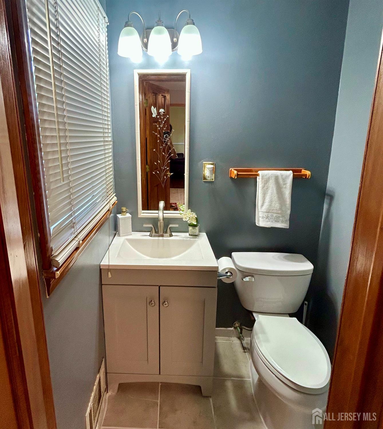 39 Taylor Road Monmouth Junction, NJ 08852 - Photo 25 of 36 a bathroom with a toilet sink and mirror