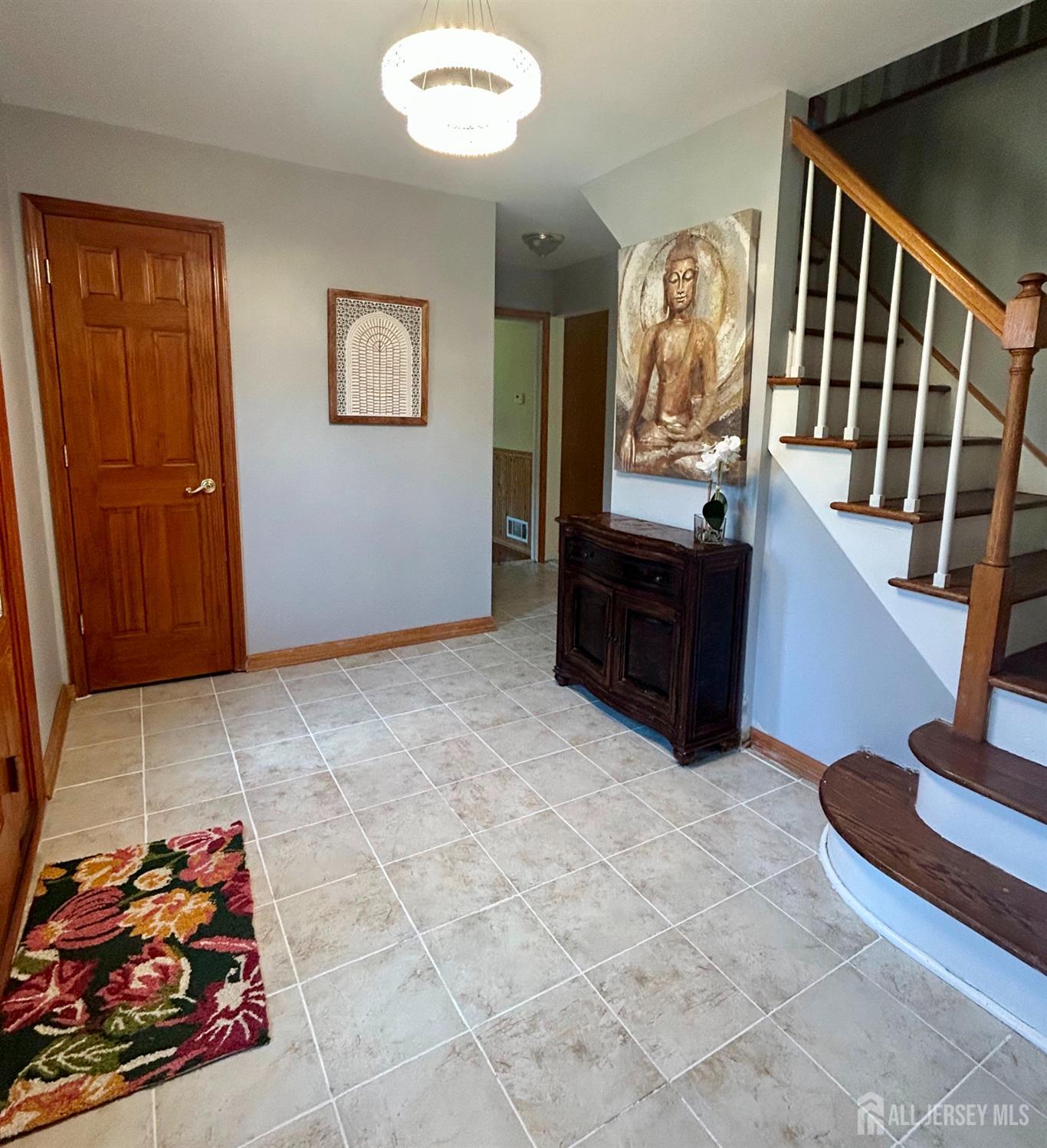 39 Taylor Road Monmouth Junction, NJ 08852 - Photo 3 of 36 a view of an entryway with wooden floor
