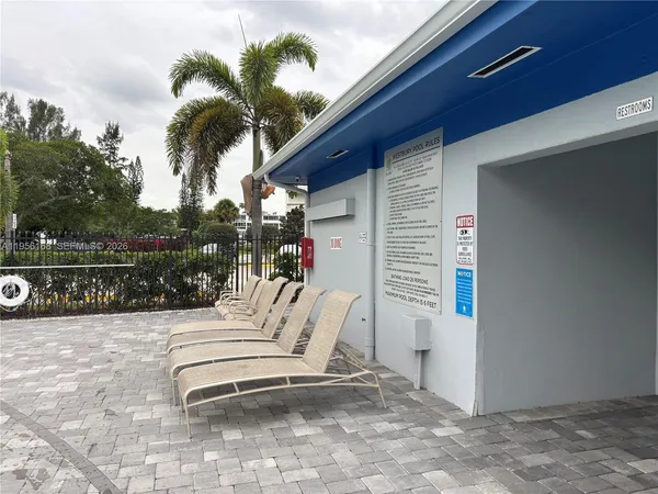a view of a house with a palm tree