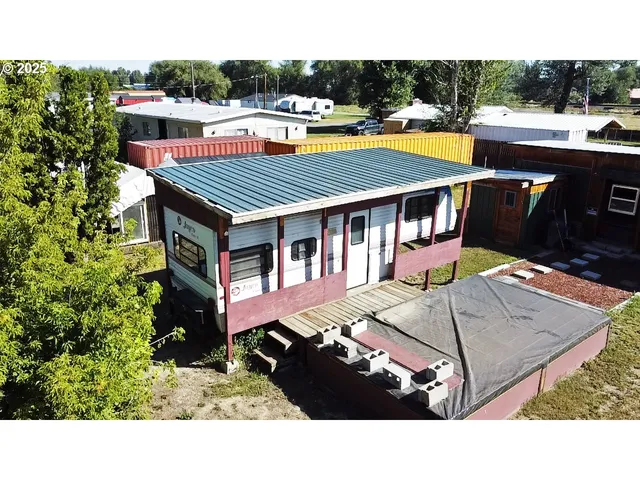 a terrace with outdoor seating and city view