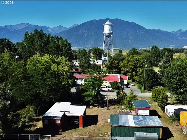 a view of a house and a yard