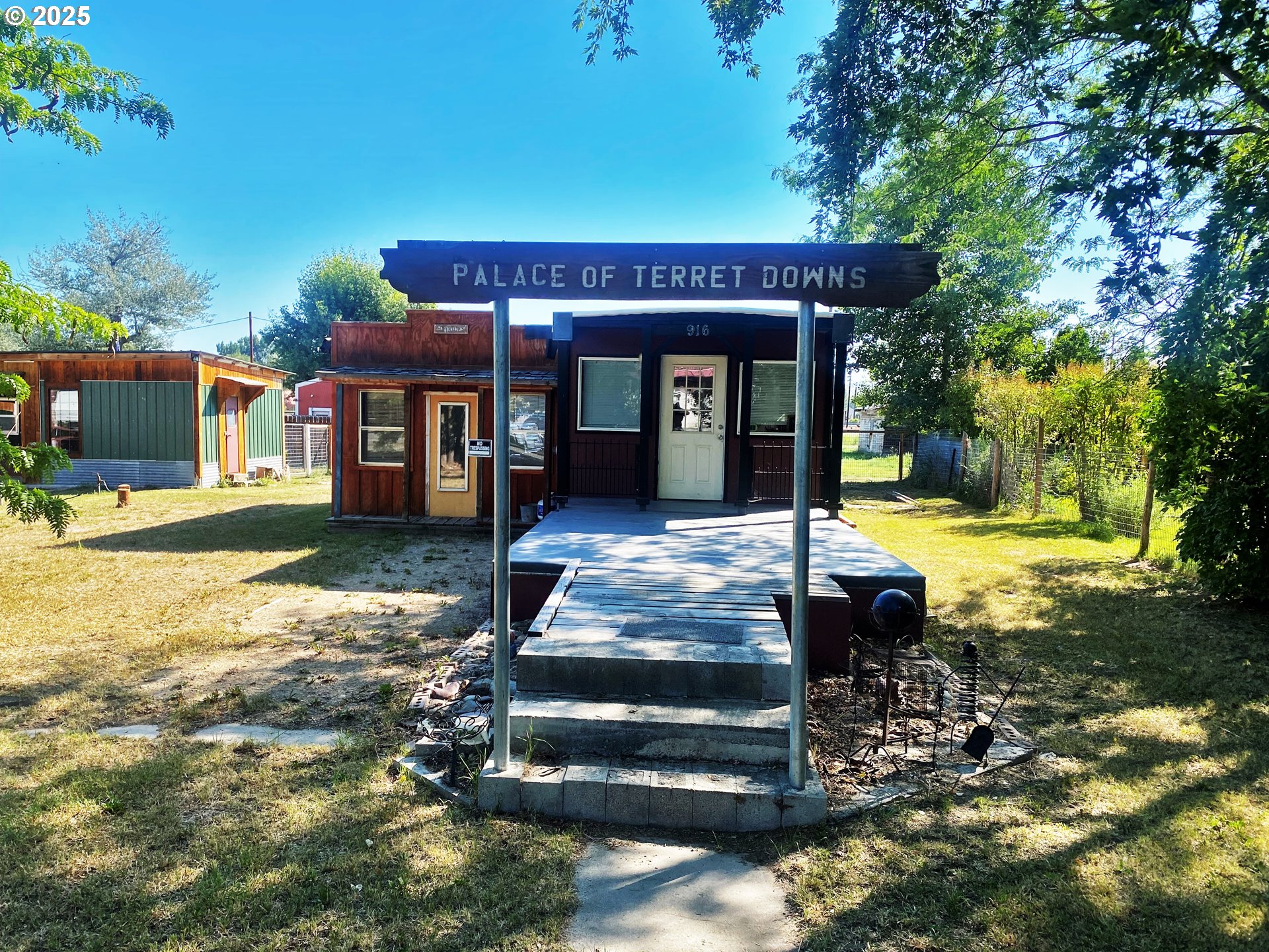 916 Robert Street Haines, OR 97833 - Photo 5 of 18 a view of a house with backyard porch and sitting area