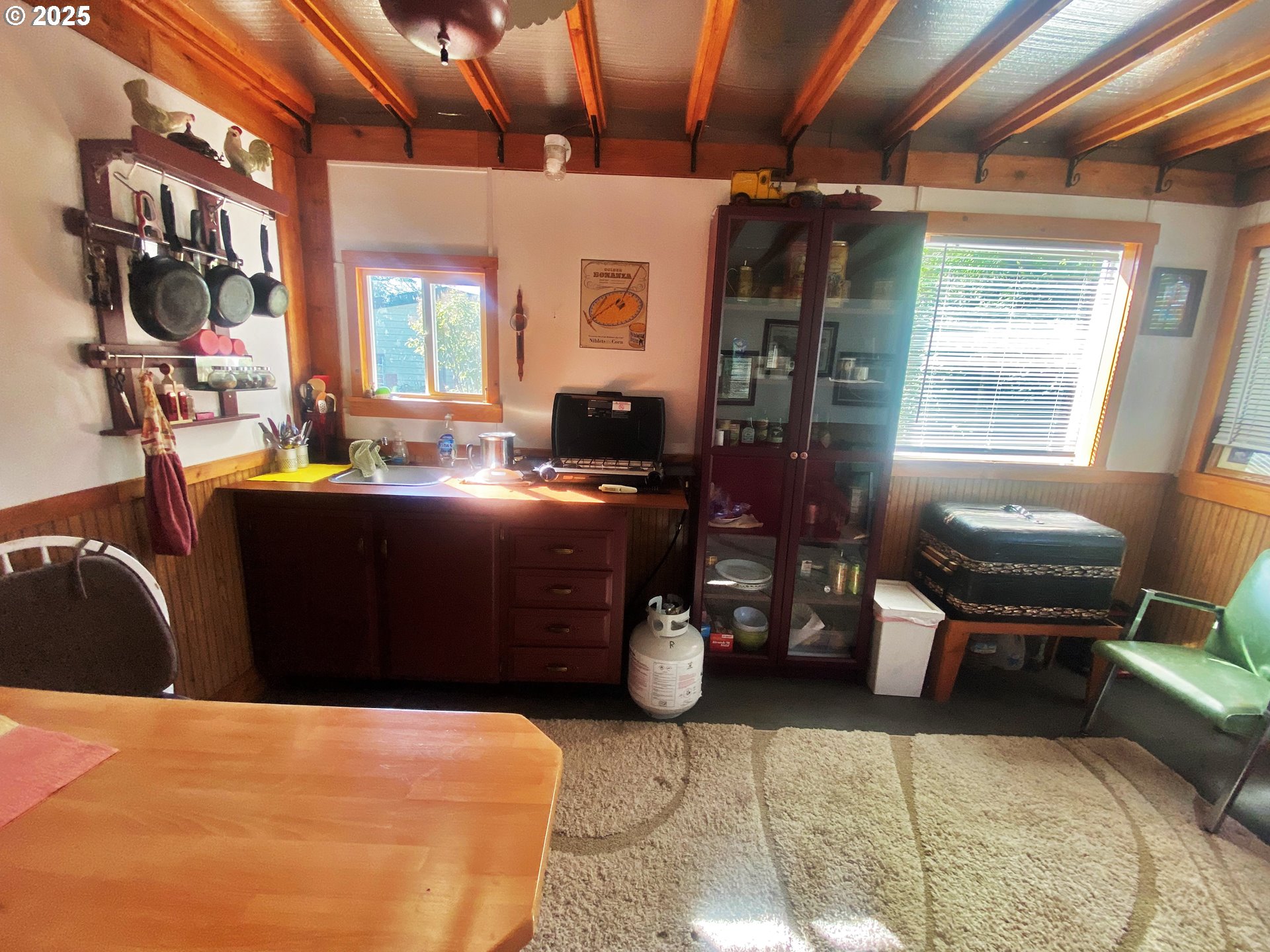 916 Robert Street Haines, OR 97833 - Photo 8 of 18 a room with furniture a flat screen tv and windows