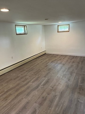 404 Cedar Street Hanover, MA 02339 - Photo 12 of 17 an empty room with wooden floor and windows