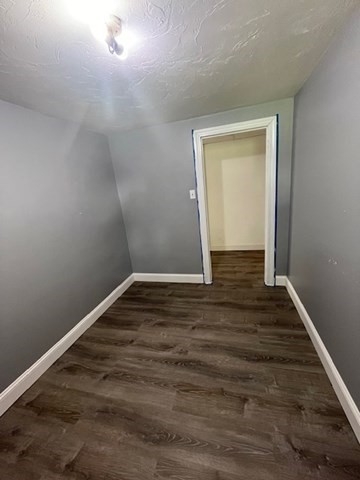 404 Cedar Street Hanover, MA 02339 - Photo 13 of 17 a view of an empty room with wooden floor