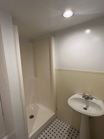 404 Cedar Street Hanover, MA 02339 - Photo 15 of 17 a bathroom with a sink a toilet a mirror and shower