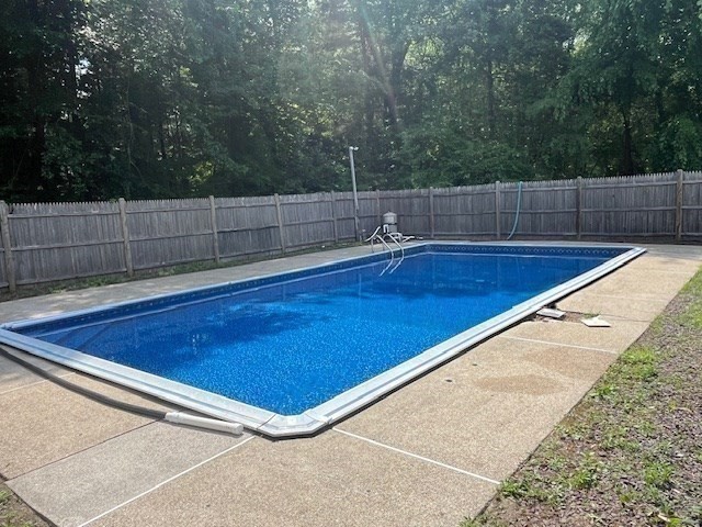 404 Cedar Street Hanover, MA 02339 - Photo 3 of 17 a view of a tennis ground with lots of trees in the background